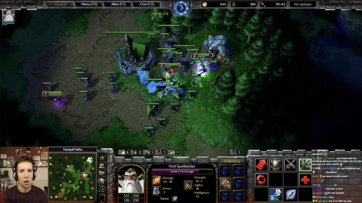 Warcraft 3 gameplay showing lots of units on screen, alongside UI for player actions
